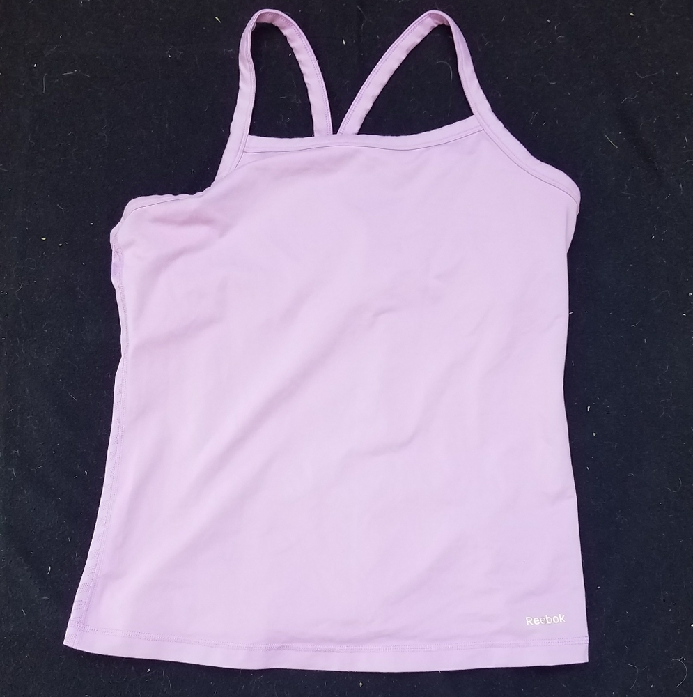 Purple Reebok tank top.